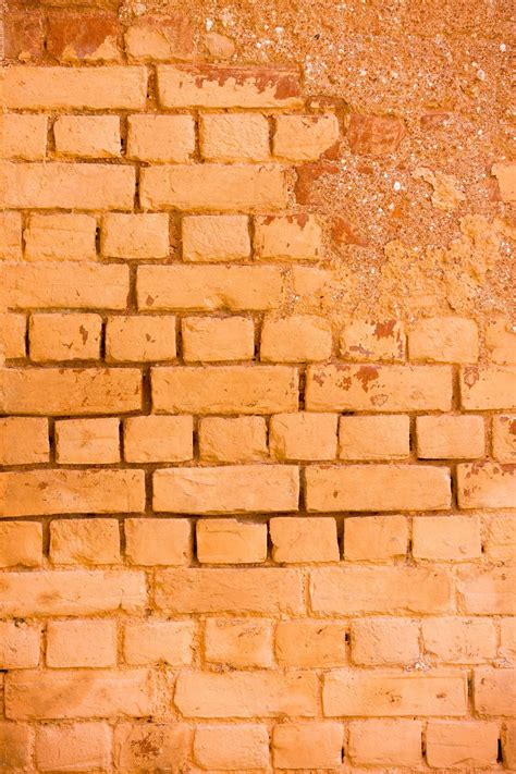 Premium Photo | Old damage brick wall with colorful graffiti
