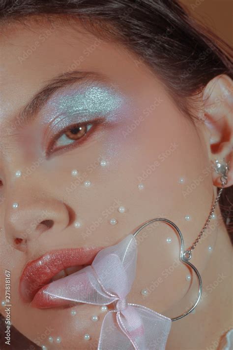 Woman with sparkly eyeshadow Stock Photo | Adobe Stock