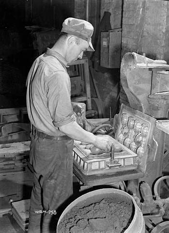 Workman placing hand grenades into a hand grenade mould at… | Flickr