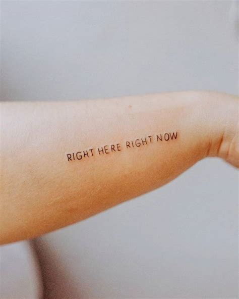 "Right here, right now" lettering tattoo on the