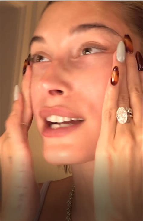 Hailey Bieber shows off huge $500K engagement ring in new video amid speculation she secretly ...