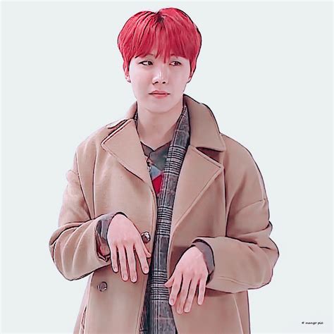a man with red hair wearing a trench coat