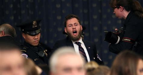 Protester at impeachment hearing: Owen Shroyer, Infowars host ...