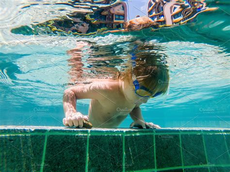 A child boy is swimming underwater stock photo containing under and water | High-Quality People ...