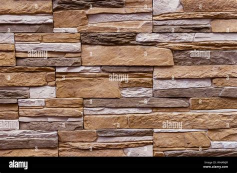 Texture of the stone wall. Panel of stones for finishing the facade of the building and interior ...