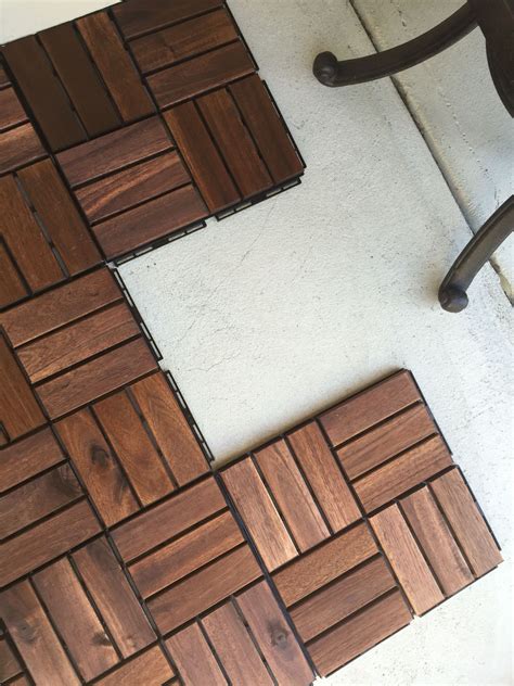 The IKEA Runnen decking tiles snap together and were pretty easy to install. Click Flooring ...