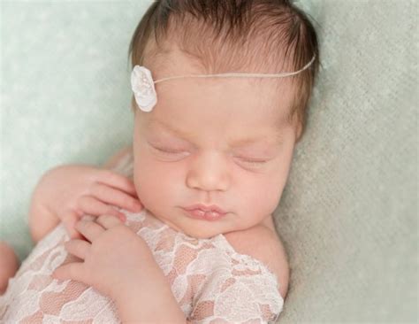 Newborn baby girl sleeping with a toy hare Stock Photo by ©tan4ikk 113245192