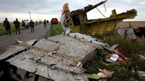 Warning: Graphic Content: Wreckage from Malaysia jetliner crash site in Ukraine | Slideshow ...