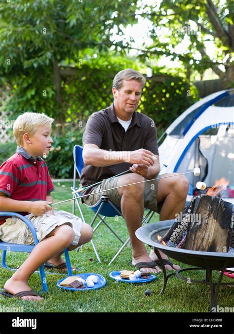 father and son camping in the backyard Stock Photo - Alamy