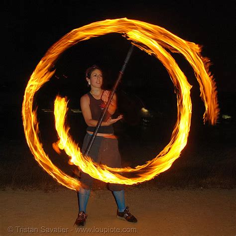 roxy spinning a fire staff