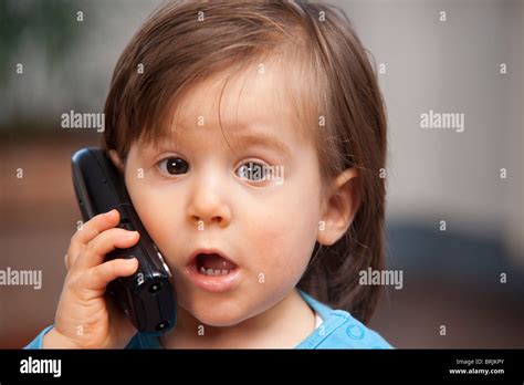 Little Boy Using Cell Phone Stock Photo - Alamy
