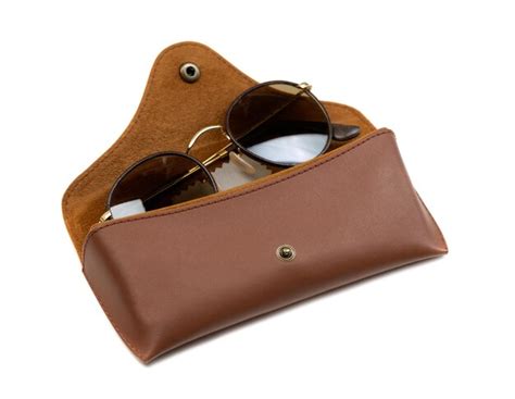 Premium Photo | Brown leather case sunglasses