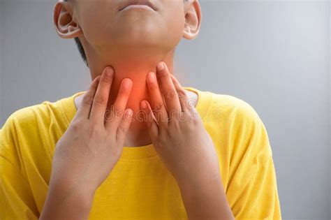 Asian Boy Touching the Neck Due To a Sore Throat or Itching in the Throat Causes of Irritation ...