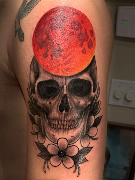 Skull Tattoo with Blood Moon and Blossoms