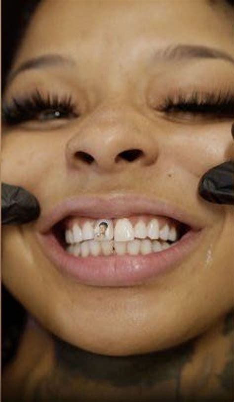 Watch Chrisean Rock Get Blueface Face Tattooed on Her Tooth - BlackSportsOnline