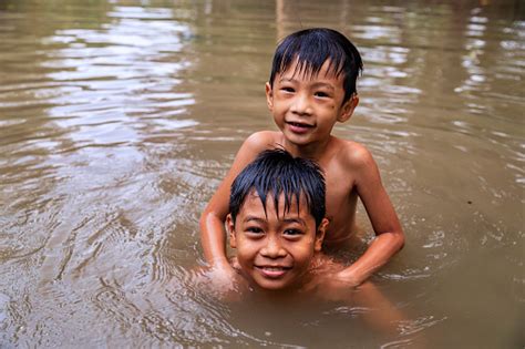 Two Little Vietnamese Boys Bathing In Mekong River Delta Vietnam Stock Photo - Download Image ...