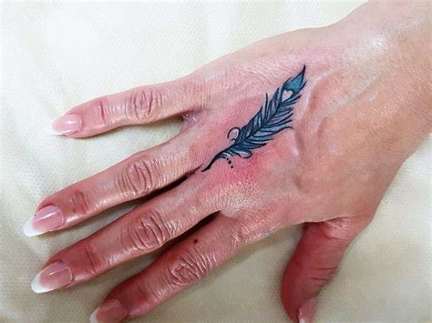Share more than 73 blue feather tattoo best - in.eteachers