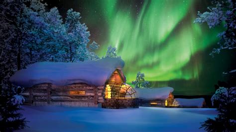 A kelo pine cabin with a glass igloo at Kakslauttanen offers the ...