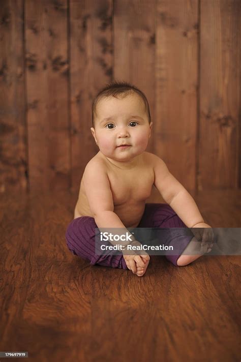 Baby Girl Sitting On Wood Floor Stock Photo - Download Image Now - Baby - Human Age, Baby Girls ...