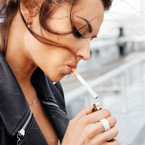 portrait of young woman smoking cigarette | Background Stock Photos ~ Creative Market