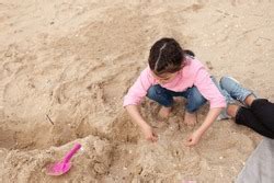 Child playing sand beach, on the beach on summer holidays. Child, a ...