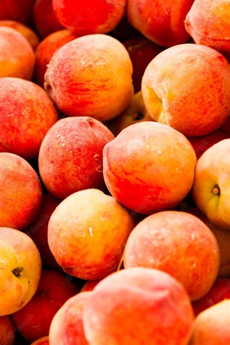 Premium Photo | First peaches of the season at the local farmer's market.