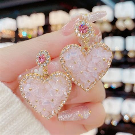 These Crystal Flower Heart Earrings are stunning! They feature a ...
