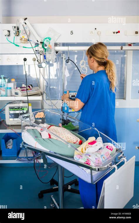 Pediatric nurse and a premature newborn baby, CHU Bordeaux France Stock Photo - Alamy