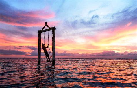 Enjoying the sunset on a swing in Gili Trawangan, Indonesia