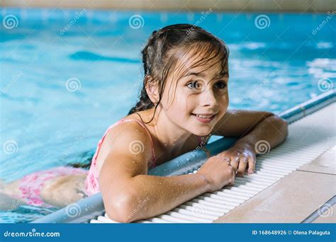 Portrait Little Girl Having Fun in Indoor Swimming-pool. the Girl is Resting at the Water Park ...