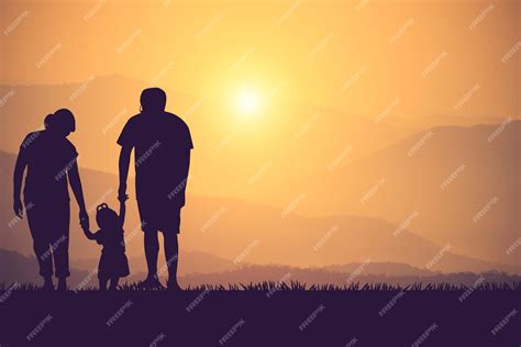 Premium Photo | Silhouette of a happy family and happy time sunset