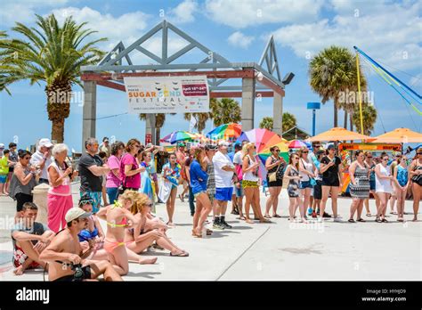 Crowds gather around the entrance to Pier 60 in Clearwater Beach, FL for entertainment ...