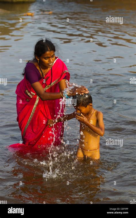 Indian woman bathing in river hi-res stock photography and images - Alamy