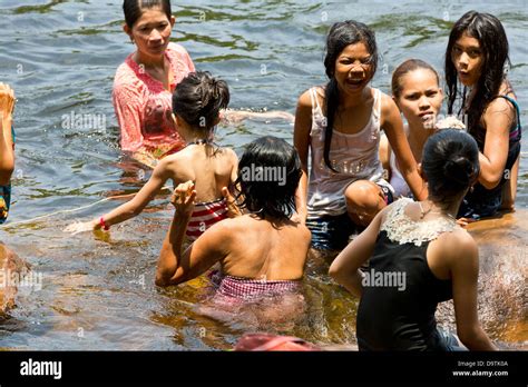 Local People taking a Bath in the River at the Teuk Chhou Rapids in Stock Photo, Royalty Free ...