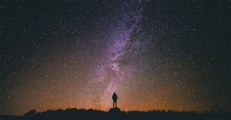 Silhouette Photo of a Person Standing on Rock · Free Stock Photo