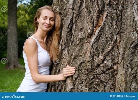 Young Woman Hugging Big Tree Stock Image - Image of happy, arms: 76144035