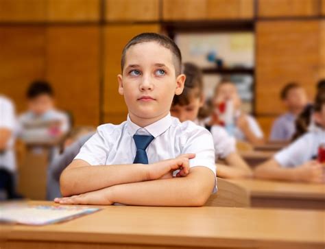 Premium Photo | Group of school kids listening to teacher in classroom