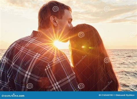 A Couple Holding Hands during an Sunset Stock Photo - Image of reflection, bond: 216544190