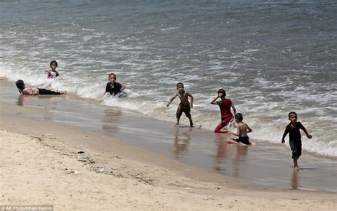 Palestinians return to Gaza City's beaches | Daily Mail Online