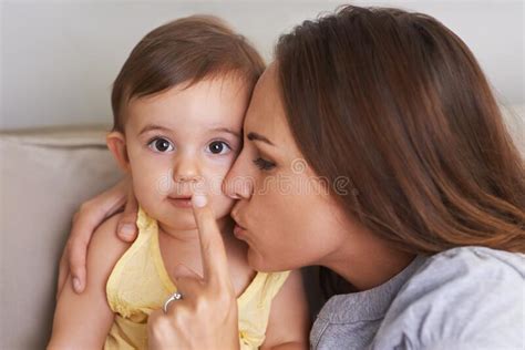 Shes Mommys Little Angel. an Adorable Little Baby and Her Mother Sharing a Cute Moment. Stock ...