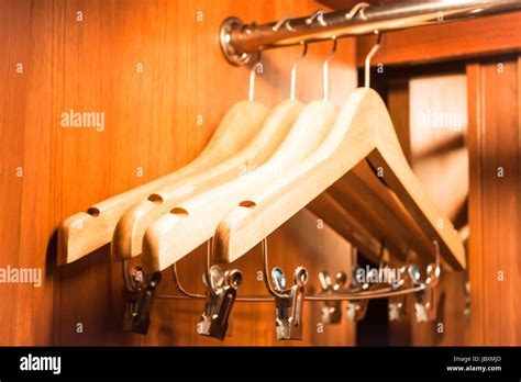 Wooden hanger hanging in a wood closet Stock Photo - Alamy