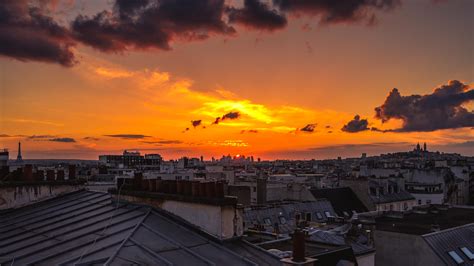 Paris sunset from a rooftop [OC] [5932x3337] : r/CityPorn