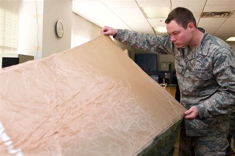 AFE Airmen maintain parachutes