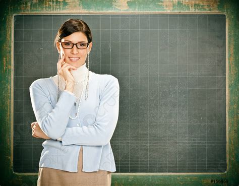 Beautiful smiling young teacher with glasses and blackbouard - stock photo 156969 | Crushpixel