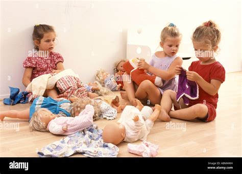 Little girls playing with their dolls Stock Photo - Alamy