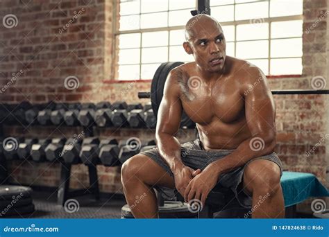 Muscular Sweaty Man Resting in Gym Stock Photo - Image of determination, rest: 147824638