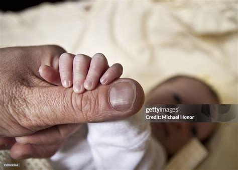 Baby Holding Hands High-Res Stock Photo - Getty Images