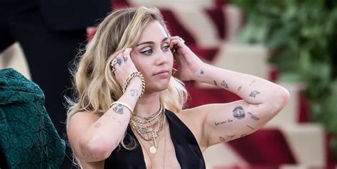 Miley Cyrus's Tattoos - Photos and Meaning of Miley Cyrus' Tattoos