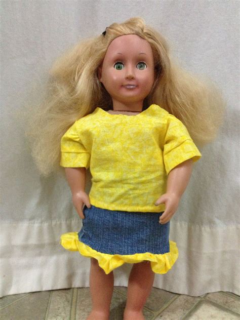 American Girl Doll in Yellow Top and Jean Skirt