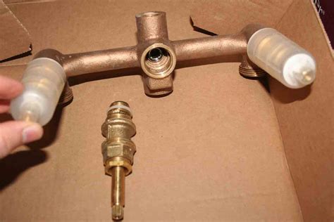 plumbing - How to fix a bathtub faucet that leaks only when the shower runs? - Home Improvement ...